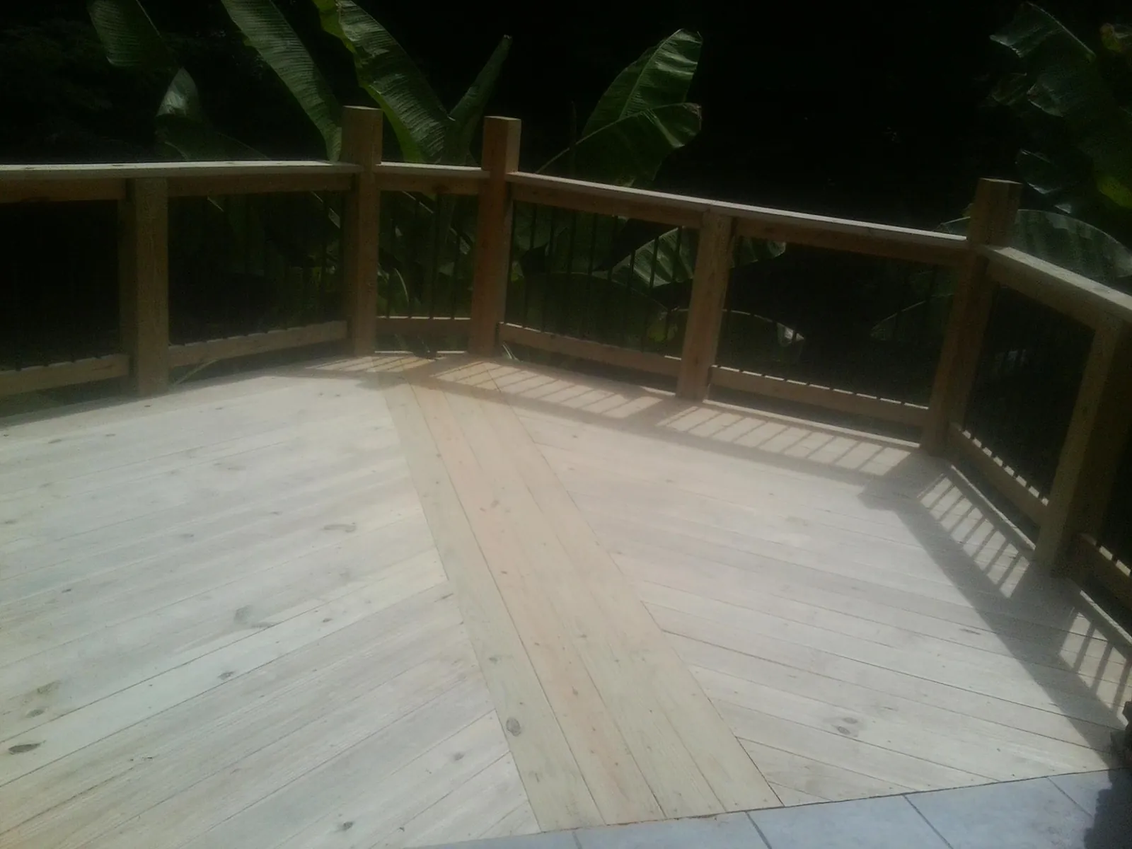 New wood deck and railing built off the back of a home in Pullman